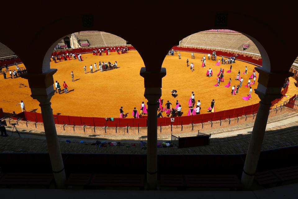 Students attend a bullfight master class for schoolchildren at the Maestranza bullring in the Andalusian capital of Seville, southern Spain, April 23, 2014.