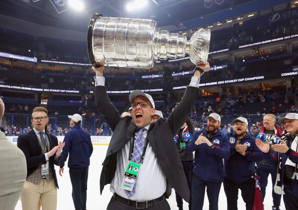 TAMPA, FLORIDA - JUNE 26: Chris MacFarland of the Colorado Avalanche carries the Stanley Cup following the series winning victory over the Tampa Bay Lightning in Game Six of the 2022 NHL Stanley Cup Final at Amalie Arena on June 26, 2022 in Tampa, Florida. (Photo by Bruce Bennett/Getty Images)