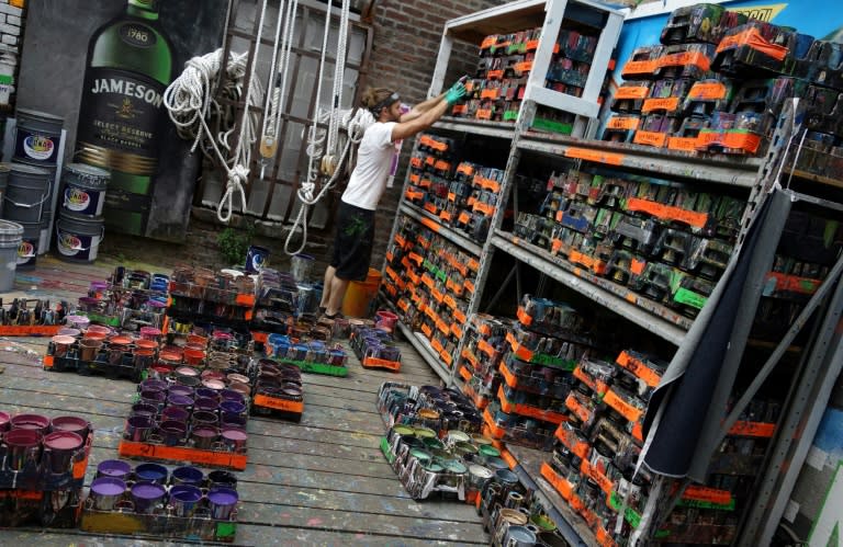 Will Krieg, an apprentice at Colossal Media, organizes paints at Colossal Media's office in New York