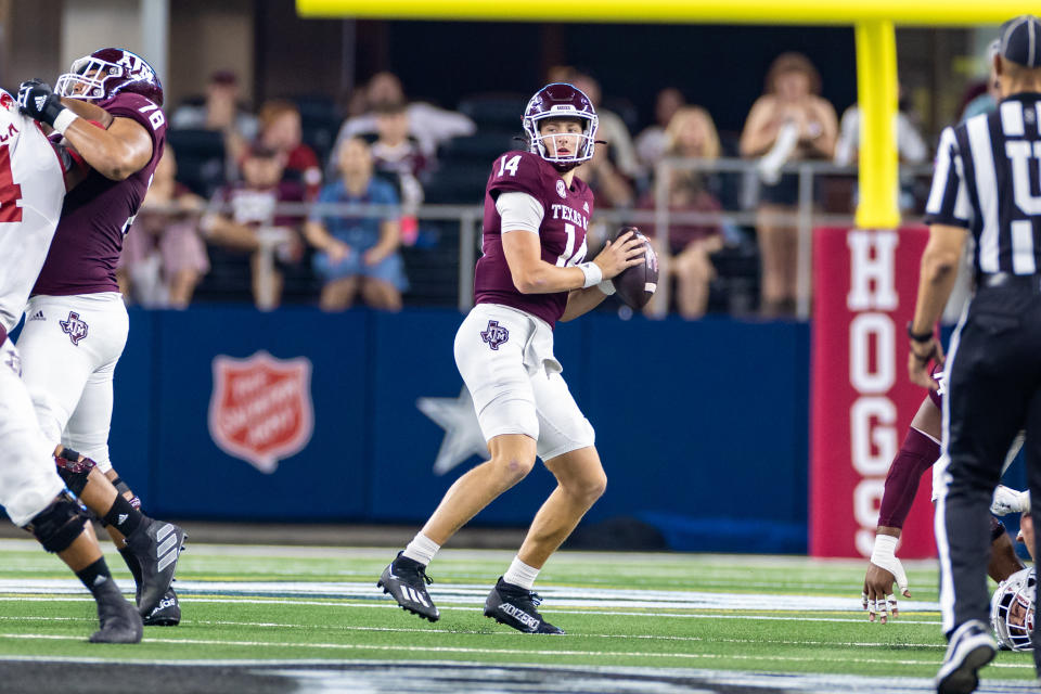 ARLINGTON, TX - SEPTEMBER 24: Texas A&M Aggies quarterback Max Johnson (#14) drops back to pass during the Southwest Classic college football game between the Texas A&M Aggies and the Arkansas Razorbacks on September 24, 2022 at AT&T Stadium in Arlington, TX.  (Photo by Matthew Visinsky/Icon Sportswire via Getty Images)