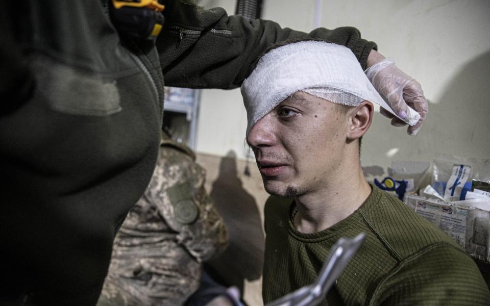 A wounded Ukrainian soldier receives treatment at Bakhmut Hospital - Anadolu Agency via Getty Images