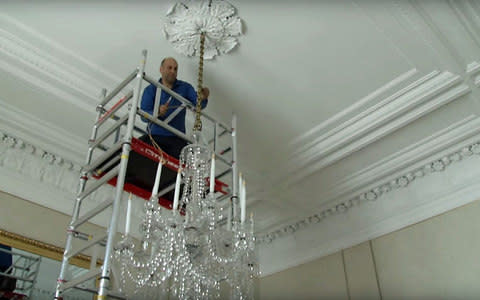 Electricians at work in Buckingham Palace - Credit: Royal Household