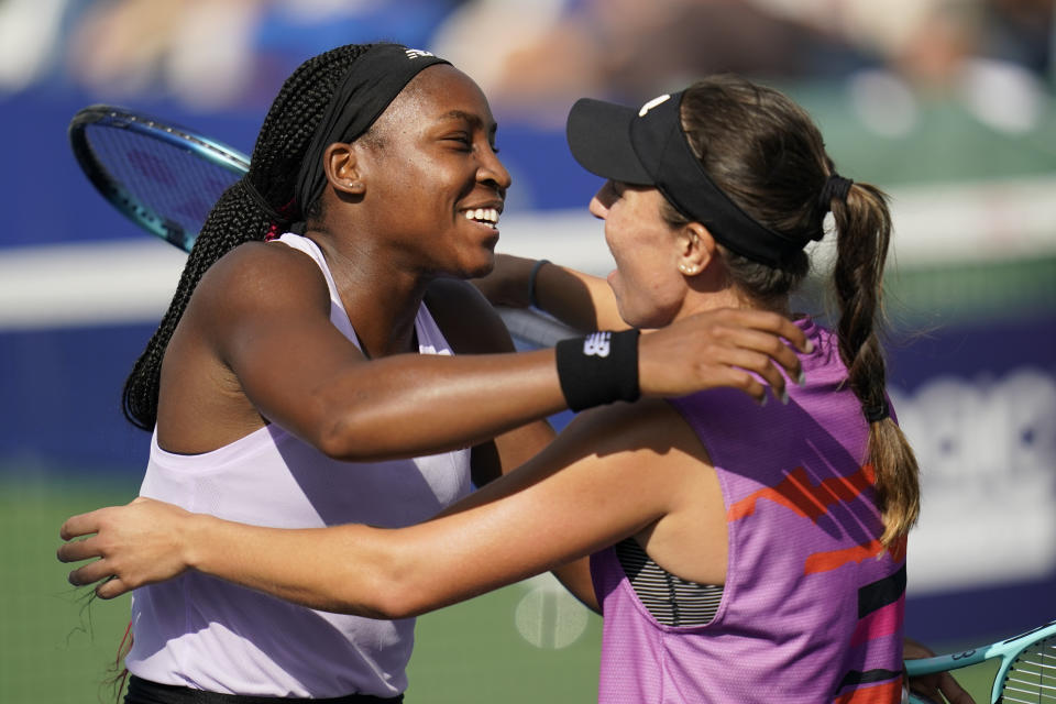 Coco Gauff, left, embraces teammate Jessica Pegula after defeating Gabriela Dabrowski, of Canada, and Giuliana Olmos, of Mexico, in the double's final at the San Diego Open tennis tournament Sunday, Oct. 16, 2022, in San Diego. (AP Photo/Gregory Bull)