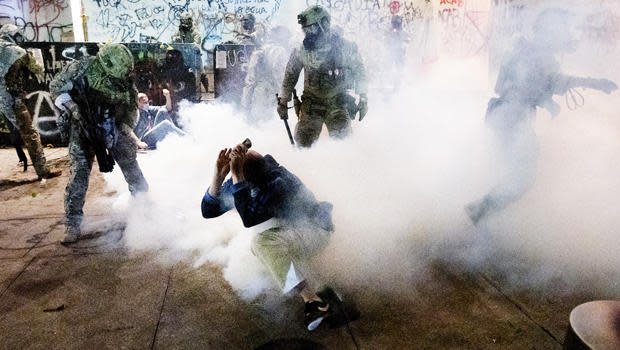 Federal officers use chemical irritants and crowd control munitions to disperse Black Lives Matter protesters outside the Mark O. Hatfield United States Courthouse on Wednesday, July 22, 2020, in Portland, Ore. / Credit: Noah Berger/AP