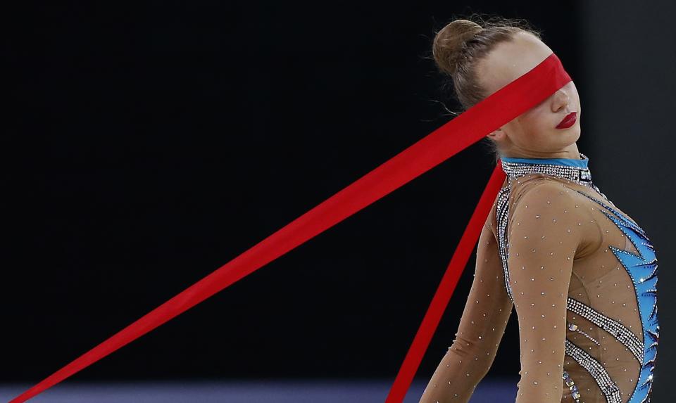 Patricia Bezzoubenko of Canada performs during her ribbon routine as she competes in the rhythmic Gymnastics individual all-around final at the 2014 Commonwealth Games in Glasgow, Scotland, in this July 25, 2014 file photo. REUTERS/Phil Noble/Files (BRITAIN - Tags: SPORT GYMNASTICS TPX IMAGES OF THE DAY)