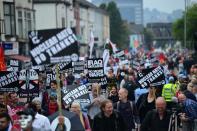 Demonstrators take part in a protest march on the sidelines of the NATO Summit in Newport, Wales, on September 4, 2014