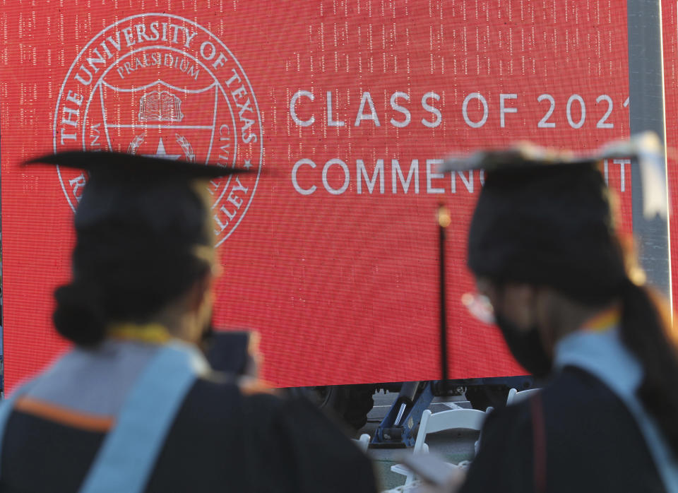 FILE - Graduates of the University of Texas Rio Grande Valley attend their commencement ceremony at the schools parking lot on Friday, May 7, 2021, in Edinburg, Texas. A deadline is fast approaching for teachers, librarians, nurses and others who work in public service to apply to have their student loan debt forgiven. New figures from the U.S. Department of Education show 145,000 borrowers have had the remainder of their debt canceled through the Public Service Loan Forgiveness program. (Delcia Lopez/The Monitor via AP, File)