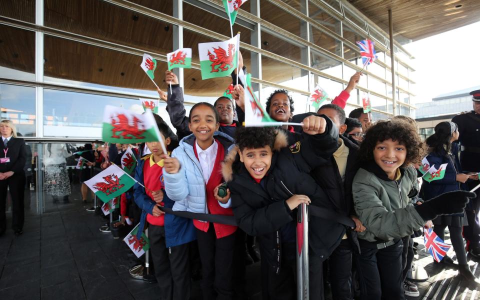 Children welcome the Queen to the opening of the Senedd in Cardiff  - Gareth Everett/Huw Evans Picture Agency