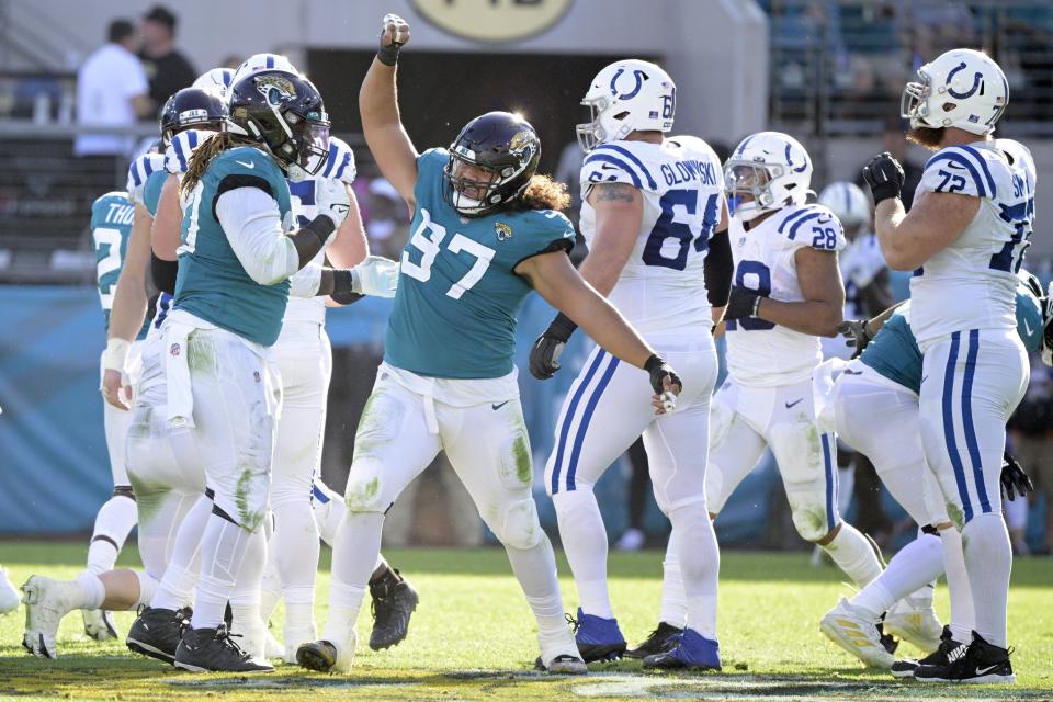 Jaguars defensive tackle Jay Tufele (97) celebrates after a play during the second half against the Indianapolis Colts on Jan. 9.