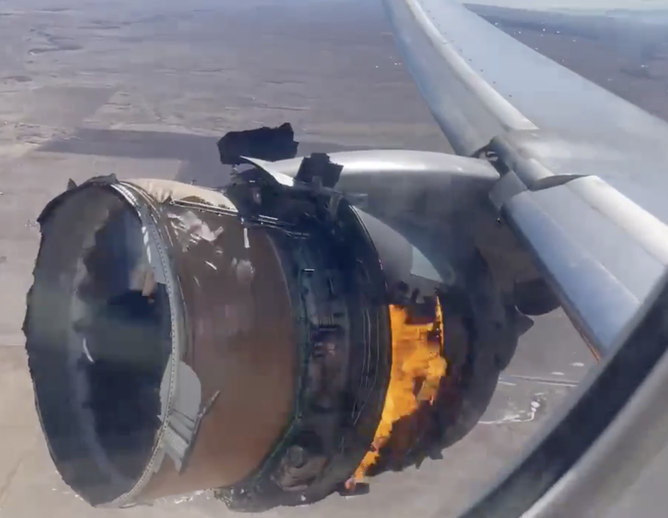A burning engine of a Boeing 777-200 as it flew over Denver.
