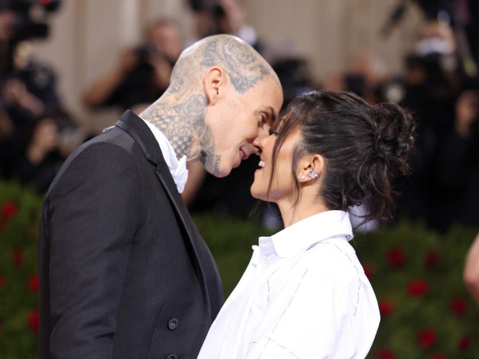 Travis Barker and Kourtney Kardashian attend the 2022 Met Gala.