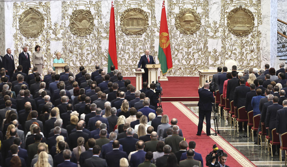 Belarusian President Alexander Lukashenko takes his oath of office during his inauguration ceremony at the Palace of the Independence in Minsk, Belarus, Wednesday, Sept. 23, 2020. Lukashenko of Belarus has assumed his sixth term of office in an inauguration ceremony that wasn't announced in advance. State news agency BelTA reports that the ceremony will take place with several hundred top government official present. (Sergei Sheleg/Pool Photo via AP)