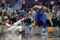Creighton guard Francisco Farabello (5) drives against UNLV guard Justin Webster (2) during the first half of an NCAA college basketball game Wednesday, Dec. 13, 2023, in Henderson, Nev. (AP Photo/John Locher)