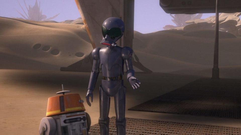 Protocol droid AP-5 stands next to the much short astromech droid Chopper on Star Wars Rebels
