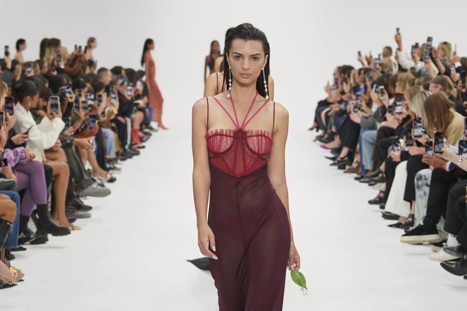 <p>Nensi Dojaka also chose to pay tribute by using the Queen's favourite flower, sending each of the models down the catwalk during the finale (lead by Emily Ratajkowski) carrying Lily of the Valley. </p>