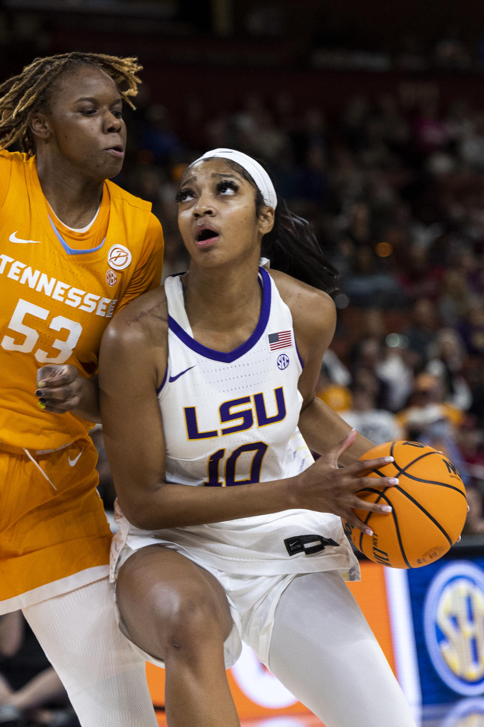 LSU's Angel Reese (10) drives to the basket against Tennessee's Jillian Hollingshead (53) in the first half of an NCAA college basketball game during the Southeastern Conference women's tournament in Greenville, S.C., Saturday, March 4, 2023. (AP Photo/Mic Smith)