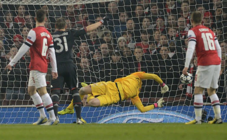 The ball slams into the back of the net past the diving Arsenal goalkeeper Wojciech Szczesny for Bayern Munich's first goal, on February 19, 2013. Goals from Toni Kroos and Thomas Mueller put the visitors 2-0 up by the 21st minute
