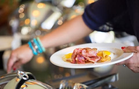 Oily eggs hardening under the heat lamp? Delicious. - Credit: GETTY