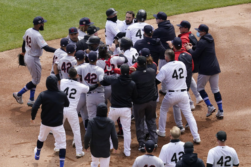 Chicago White Sox and Cleveland Indians benches clear after a pushing incident at second base during the first inning of a baseball game in Chicago, Thursday, April 15, 2021. (AP Photo/Nam Y. Huh)