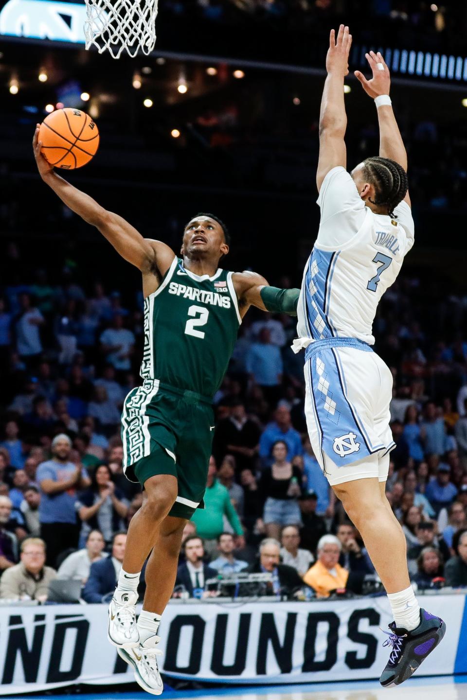 Michigan State guard Tyson Walker (2) goes to the basket against North Carolina guard Seth Trimble (7) during the second half of the NCAA tournament West Region second round at Spectrum Center in Charlotte, N.C. on Saturday, March 23, 2024.