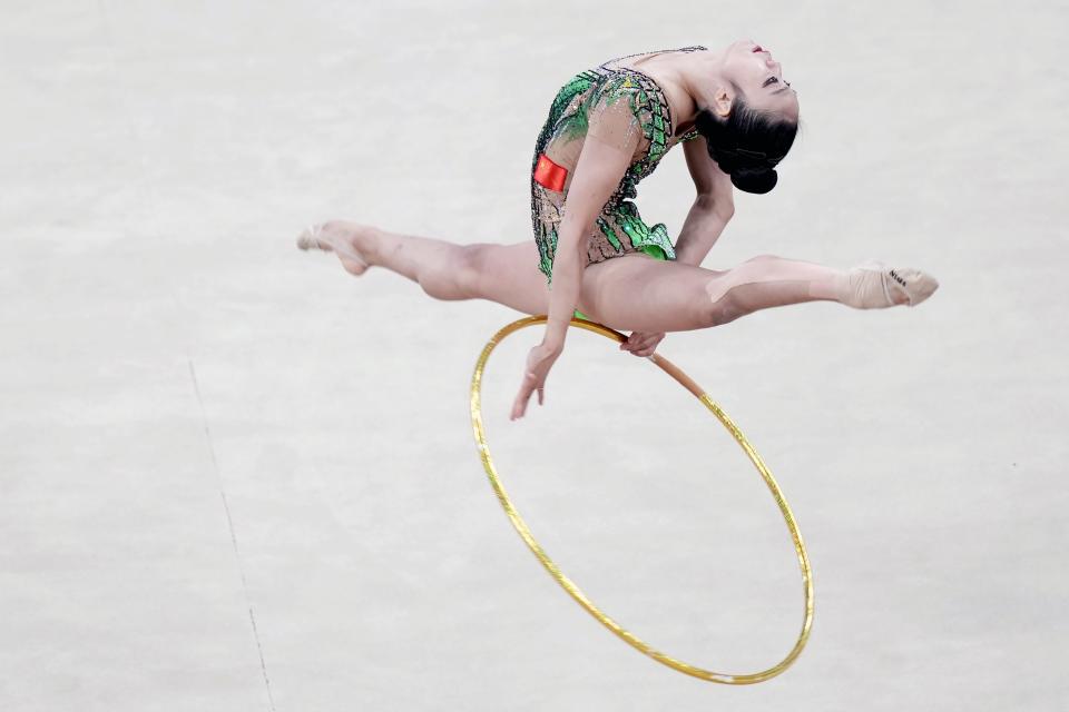 Zhao Yating of China performs during Individual qualification and Individual team final subdivision 2 of Rhythmic Gymnastics final at the 19th Asian Games in Hangzhou, China, Friday, Oct. 6, 2023. (AP Photo/Eugene Hoshiko)