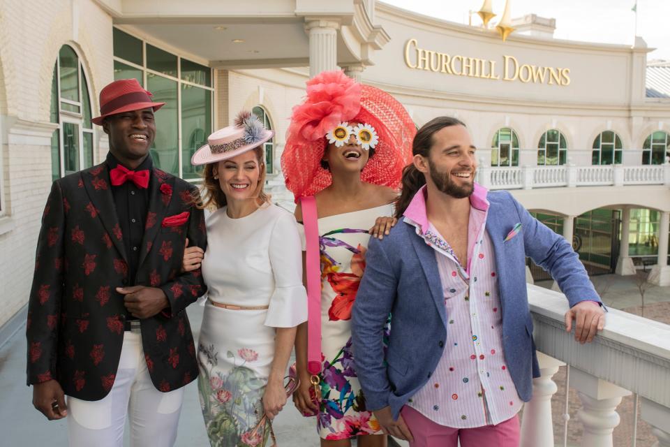 Models Aaron Thornton, from left, Hope Daniels, Shantay Chandler and Josh Frank during a Kentucky Derby fashion shoot with stylist Jo Ross at Churchill Downs. Thornton is wearing a Black/red floral Tallia jacket ($195), black Calvin Klein shirt ($29.50), with white Ballin trousers ($195). Daniels wears a pastel floral print Ted Baker mid-calf length dress ($315), with a pastel straw boater Simply Laura hat ($375). Chandler wears a coral ruffled Frank Olive hat, ($900), bright float off shoulder Frank Lyman dress ($178), hot pink Marc Jacobs tiny bag ($395), with daisy sunglasses ($9). Frank is in a blue JKT New York sport coat, ($300), floral Bugatchi shirt ($179), hot pink Bugatchi shirt ($149), with hot pink Santorelli pants ($225). All can be found at Von Maur. March 28, 2019