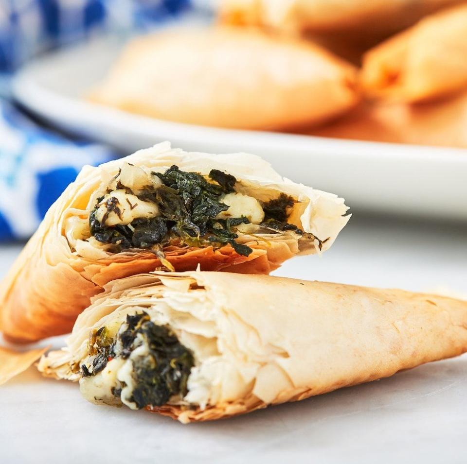 <p>Don't forget to cover your filo dough with a lightly damp kitchen towel. Uncovered, the dough gets hard and dry in record time, and it is NOT pleasant trying to fold a crumbly sheet of filo. </p><p>Get the <a href="https://www.delish.com/uk/cooking/recipes/a31149387/spanakopita-spinach-pie-recipe/" rel="nofollow noopener" target="_blank" data-ylk="slk:Spanakopita;elm:context_link;itc:0;sec:content-canvas" class="link ">Spanakopita</a> recipe.</p>