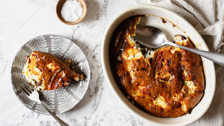 Baked frittata with napkin and spoon and small piece on plate