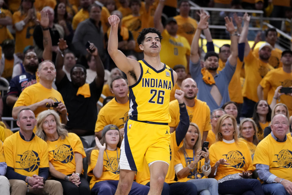 Indiana Pacers guard Ben Sheppard (26) celebrates after making a three-point basket during the second half of Game 6 against the New York Knicks in an NBA basketball second-round playoff series, Friday, May 17, 2024, in Indianapolis. (AP Photo/Michael Conroy)