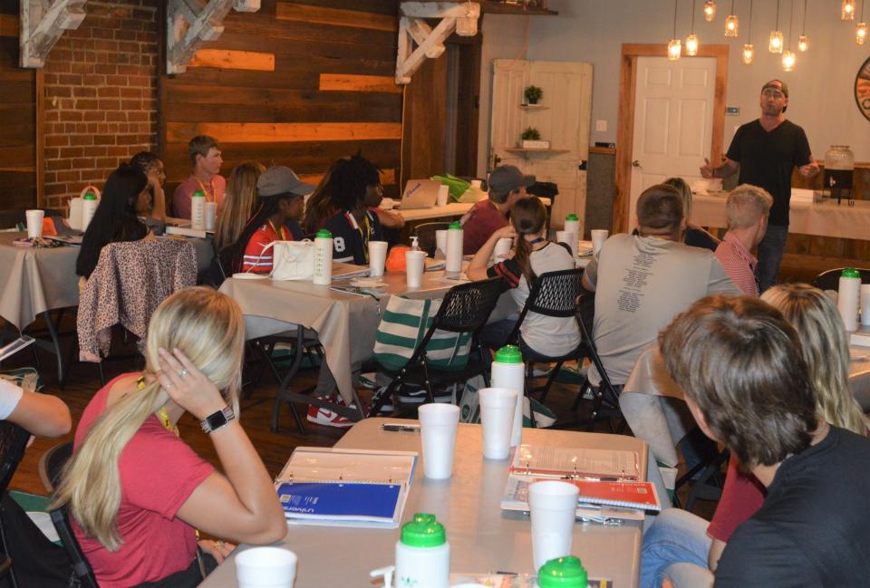 Boone Blackmon of Blackmon Outfitters, a native of Louisville, talks to this year's Youth Leadership participants about how he started his business.