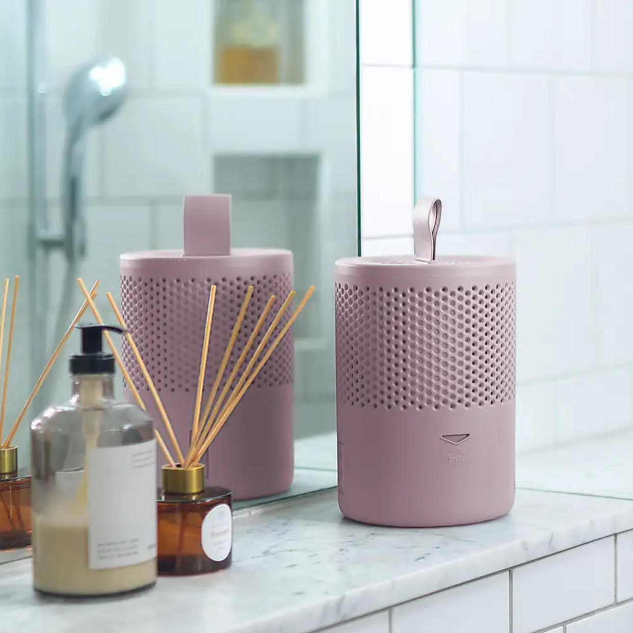  Pink Absodry dehumidifier on bathroom shelf. 