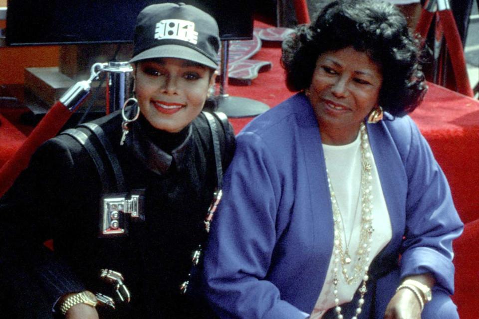 <p>Jim Smeal/Ron Galella Collection via Getty</p> Janet Jackson poses for a photo with mother Katherine Jackson 