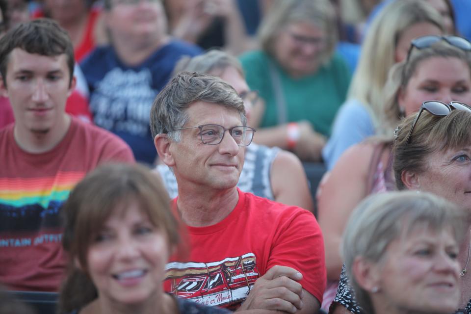 Richard Berens (wearing glasses) gets a shout out from his comedian son Charlie during Charlie Berens' Wisconsin State Fair show on August 10, 2022. When Richard was handed a microphone, he pretended to forget his son's name.