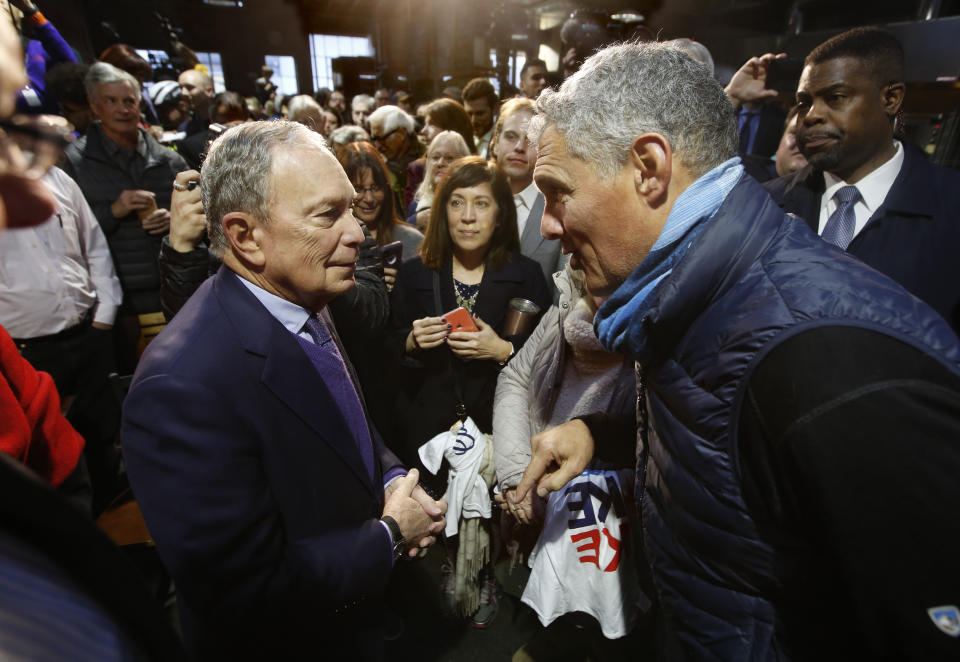 Democratic presidential candidate and former New York City Mayor Michael Bloomberg, left, talks with Josh Pane, right, who attended a campaign event Bloomberg held in Sacramento, Calif., Monday, Feb. 3, 2020. (AP Photo/Rich Pedroncelli)