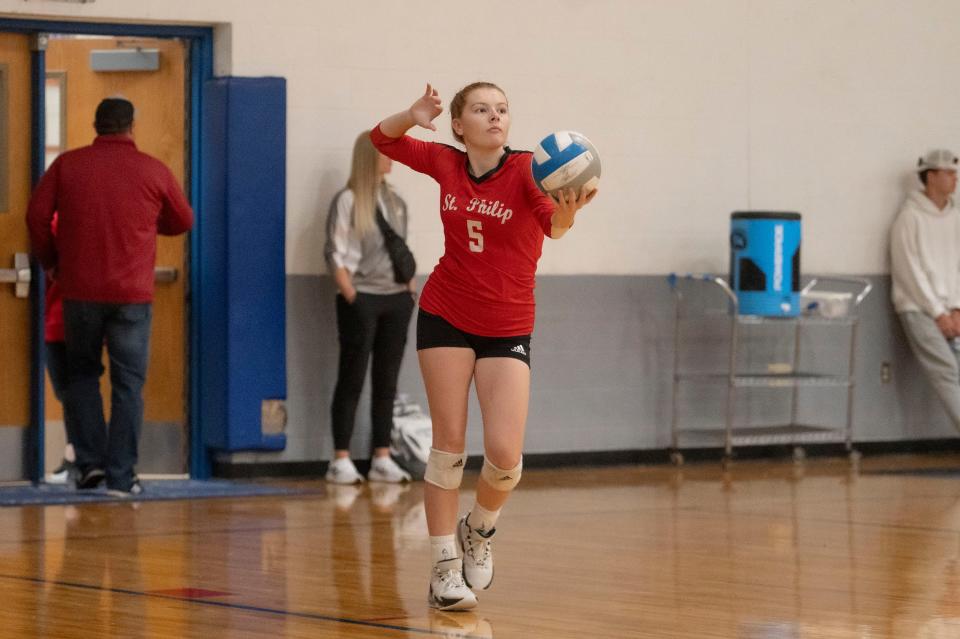 St. Philip sophomore Addi Dzwik serves during the Cereal City volleyball tournament hosted by Harper Creek High School on Saturday, Sept. 7, 2024.