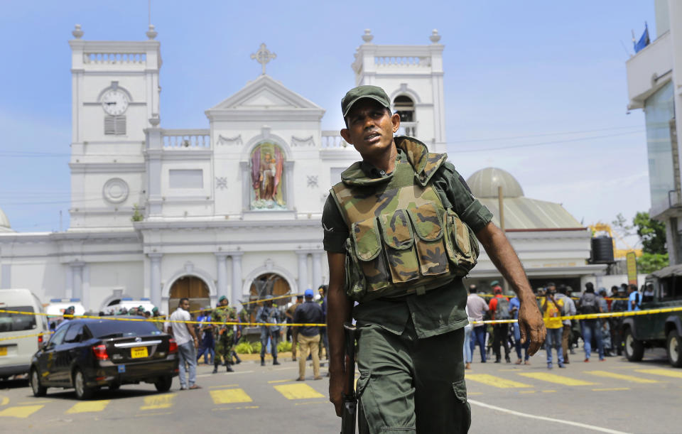 FILE - In this April 21, 2019 file photo, Sri Lankan Army soldiers secure the area around St. Anthony's Shrine after a blast in Colombo, Sri Lanka. Sri Lankans will be voting Saturday for a new president after weeks of campaigning that largely focused on national security and religious extremism in the backdrop of the deadly Islamic State-inspired suicide bomb attacks on Easter Sunday. (AP Photo/Eranga Jayawardena, File)