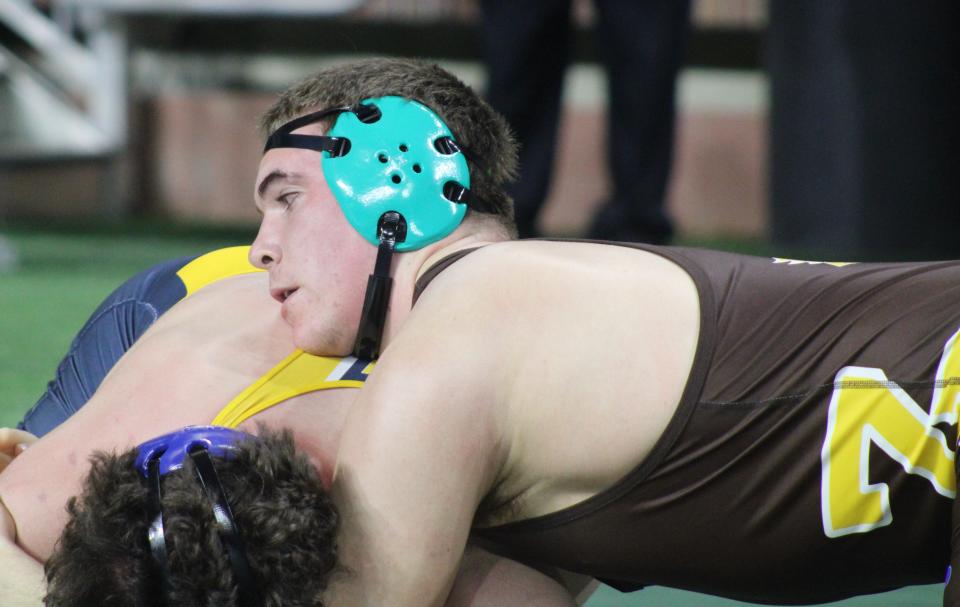 Zeeland East's Parker Williams battles Goodrich's James Mahon in the Division 2 state finals at 285 pounds on Saturday, March 2, 2024, at Ford Field in Detroit.