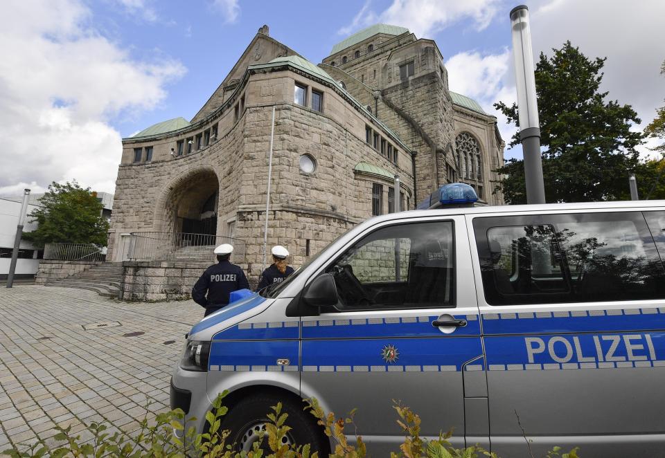 Police secures the old synagogue in Essen, Germany, Thursday, Oct. 10, 2019. A heavily armed assailant ranting about Jews tried to force his way into a synagogue in Halle, Germany yesterday, before he killed two people nearby. (AP Photo/Martin Meissner)