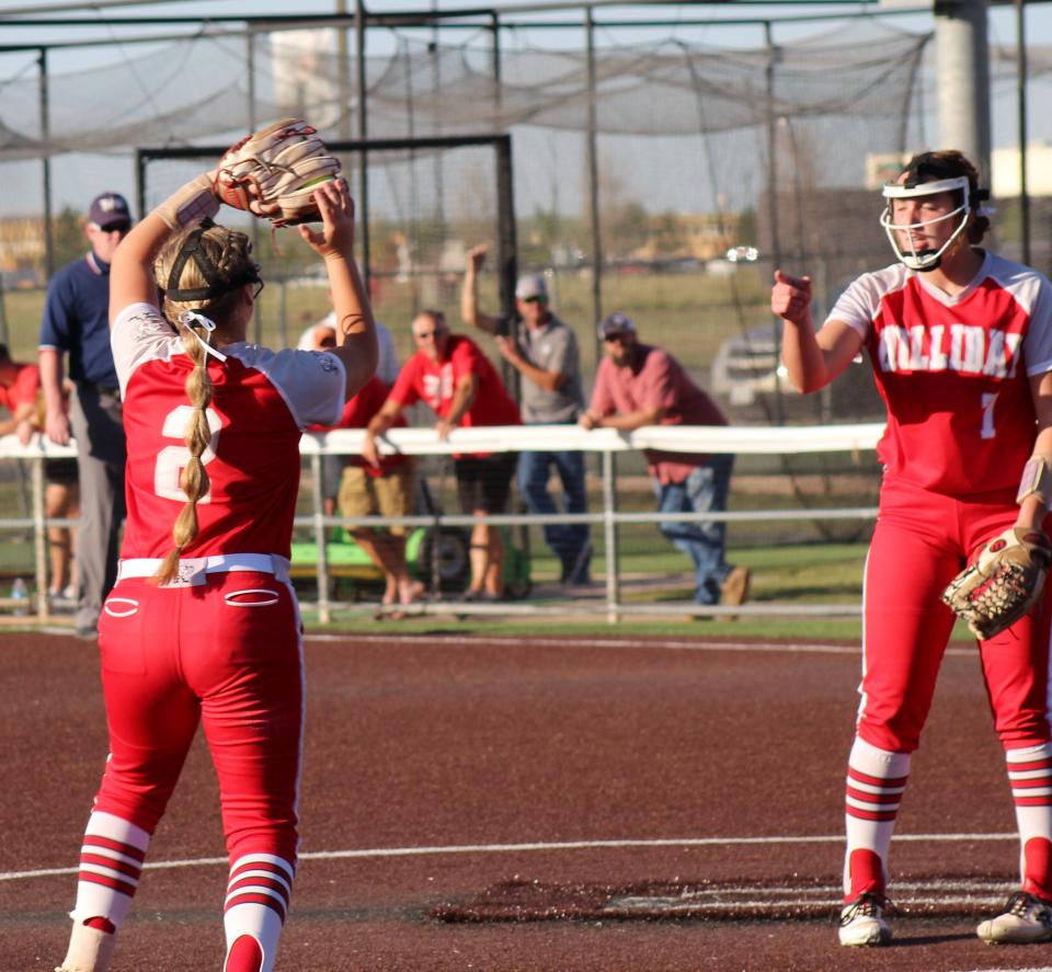 Holliday pitcher Addison LIndemann signals an out as third baseman Kinley Marek (2) makes the catch on a popup against Coahoma. Lindemann gave up just four hits but lost 5-1 in Game 1 of the Region I-3A championship series Thursday.