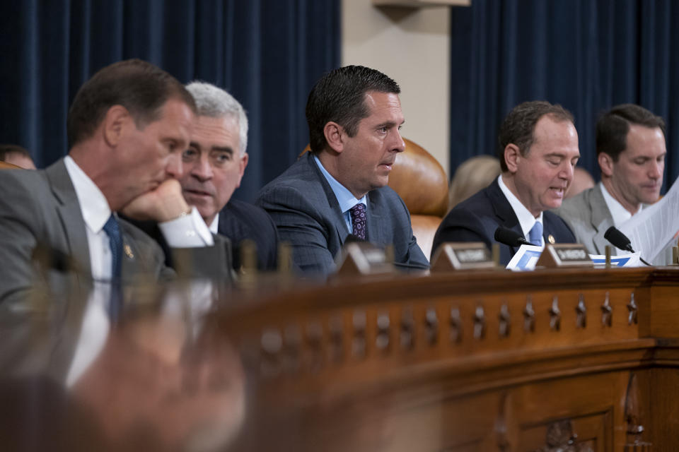 Rep. Devin Nunes, R-Calif, ranking member of the House Intelligence Committee, center, is joined by, from left, Rep. Chris Stewart, R-Utah, Rep. Brad Wenstrup, R-Ohio, Chairman Adam Schiff, D-Calif., and Rep. Jim Himes, D-Conn., during a hearing on politically motivated fake videos and manipulated media, on Capitol Hill in Washington, Thursday, June 13, 2019. (AP Photo/J. Scott Applewhite)