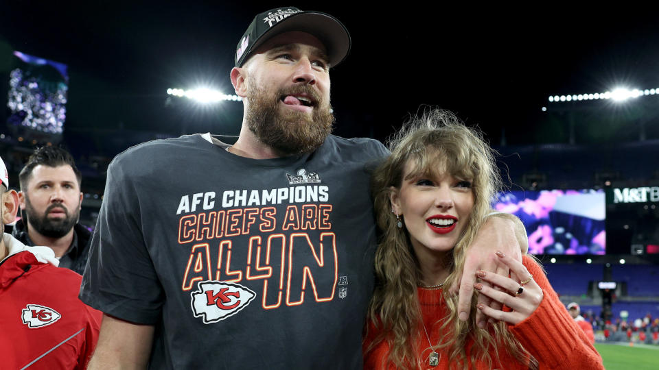 Travis Kelce posing with Taylor Swift at the Chiefs game