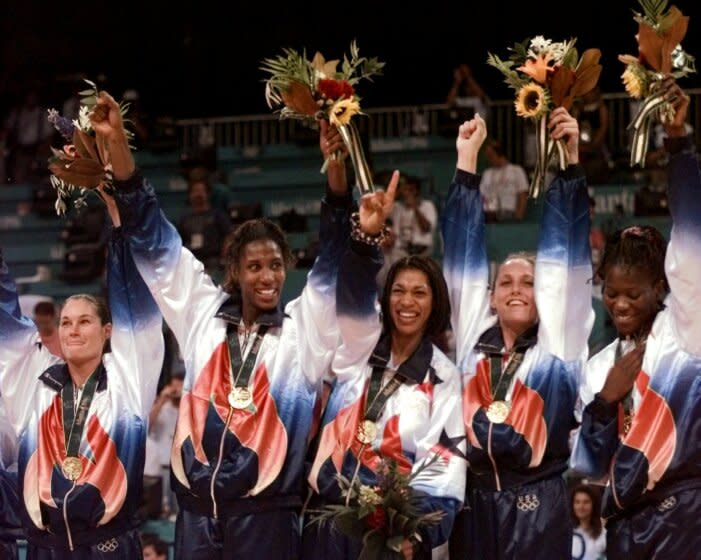 FILe - In this Aug. 4, 1996, file photo, U.S. women's basketball team members wear their gold medals during ceremonies at the Centennial Summer Olympic Games in Atlanta. From left are Jennifer Azzi, Lisa Leslie, Carla McGhee, Katy Steding and Sheryl Swoopes. That team, which started training together in 1995, was the foundation for the launch of the ABL and the WNBA. The ABL lasted only two years, but the WNBA is now in its 20th season. (AP Photo/Susan Ragan, File)