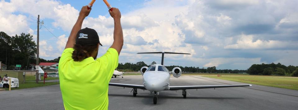 A private jet is guided to a stop at DeFuniak Springs Municipal Airport. Walton County commissioners voted unanimously Tuesday to allocate $5.5 million of the county's federal American Recovery Plan Act dollars to an $11 million expansion and widening of the airport's Runway 9/27.