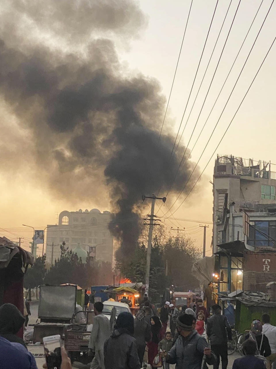 Smoke rise on the sky following a bomb explosion in Kabul, Afghanistan, on Saturday, Nov. 13, 2021. Emergency workers say a bomb has exploded on a mini-bus on a busy commercial street in a Kabul neighborhood mainly populated by members of Afghanistan’s minority Hazara community. (AP Photo)