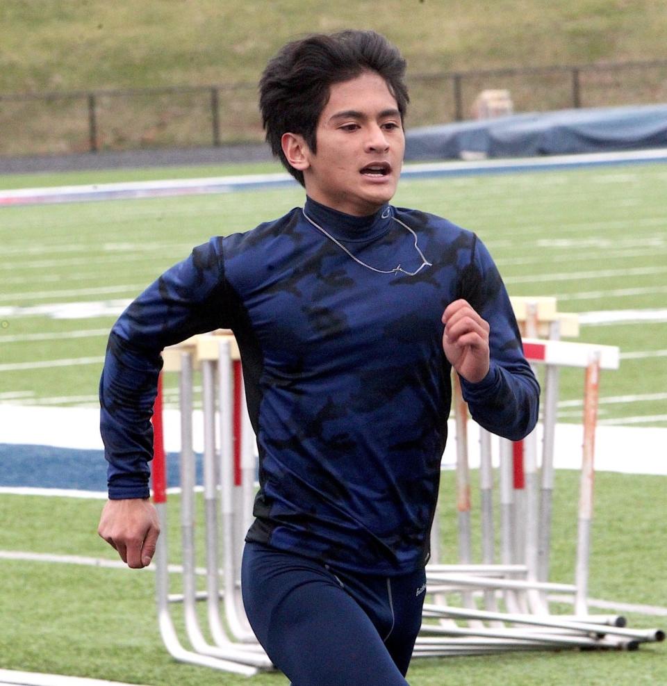 BNL sophomore Christian Garciano-Curren churns through a workout during preseason track practice. Garciano-Curren and the rest of the 4 x 100 relay qualified for regional during Thursday's BNL Track & Field Sectional.