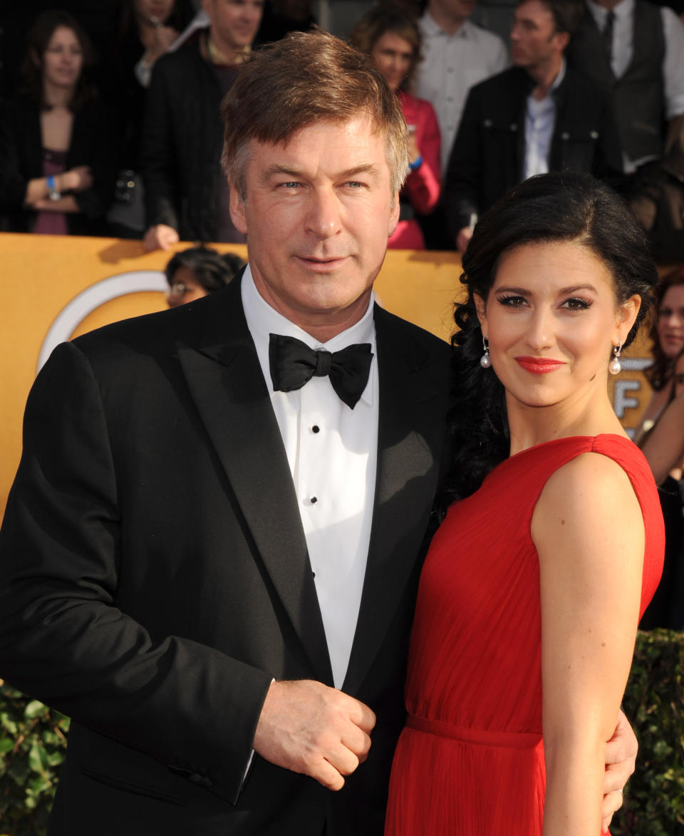 FILE - In this Jan. 27, 2013 file photo, Alec Baldwin, left, and Hilaria Thomas arrive at the 19th Annual Screen Actors Guild Awards at the Shrine Auditorium in Los Angeles. A Canadian bit-part actress, Genevieve Sabourin (ZHAHN'-vee-ehv sah-boor-EH'), is accused of barraging Baldwin with lovesick, demanding messages and showing up outside his New York apartment building. Her trial opened Thursday, Nov. 7, 2013, in Manhattan. (Photo by Jordan Strauss/Invision/AP, File)