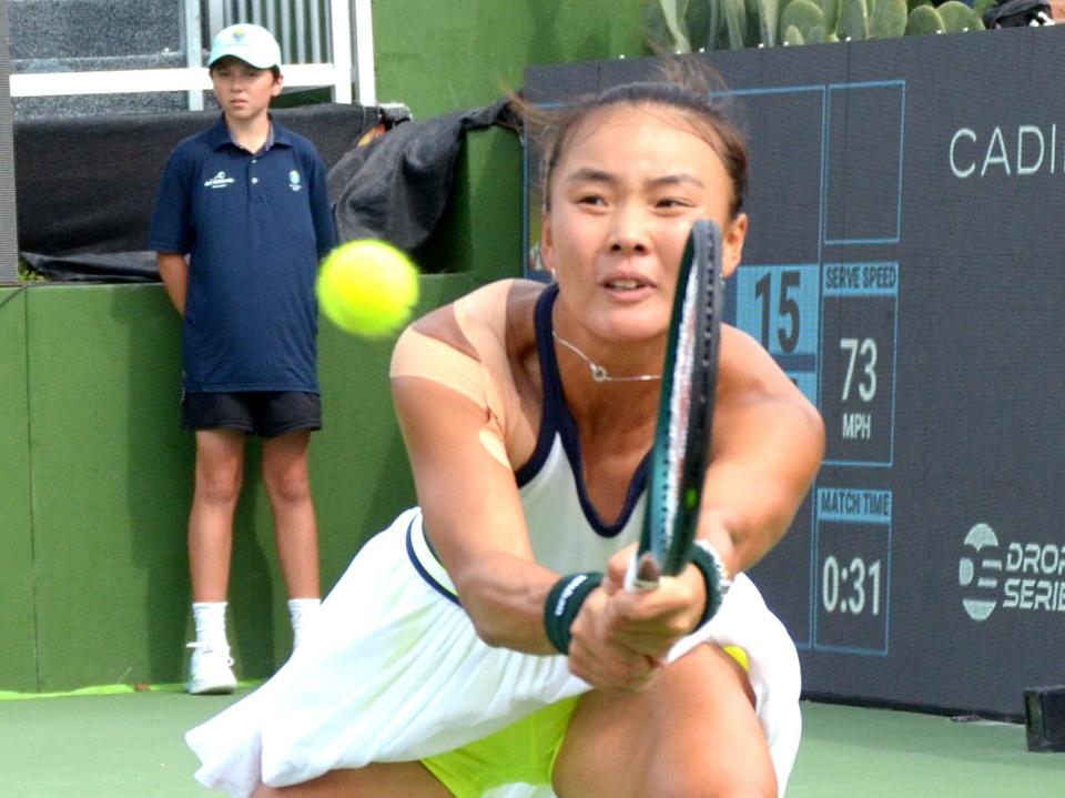 Yue Yuan of China stretches to return a shot during Sunday's ATX Open singles final at Westwood Country Club. Yuan beat fellow Chinese player Xiyu Wang 6-4, 7-6 (7-4) in a match that took over two hours to complete.