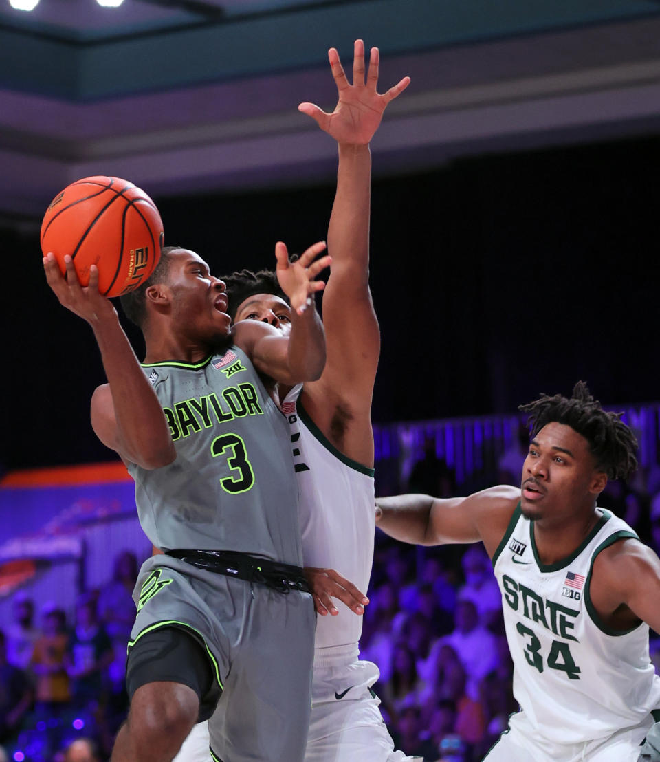 In this photo provided by Bahamas Visual Services, Baylor guard Dale Bonner (3) looks to shoot against Michigan State during an NCAA college basketball game at Paradise Island, Bahamas, Friday, Nov. 26, 2021. (Tim Aylen/Bahamas Visual Services via AP)