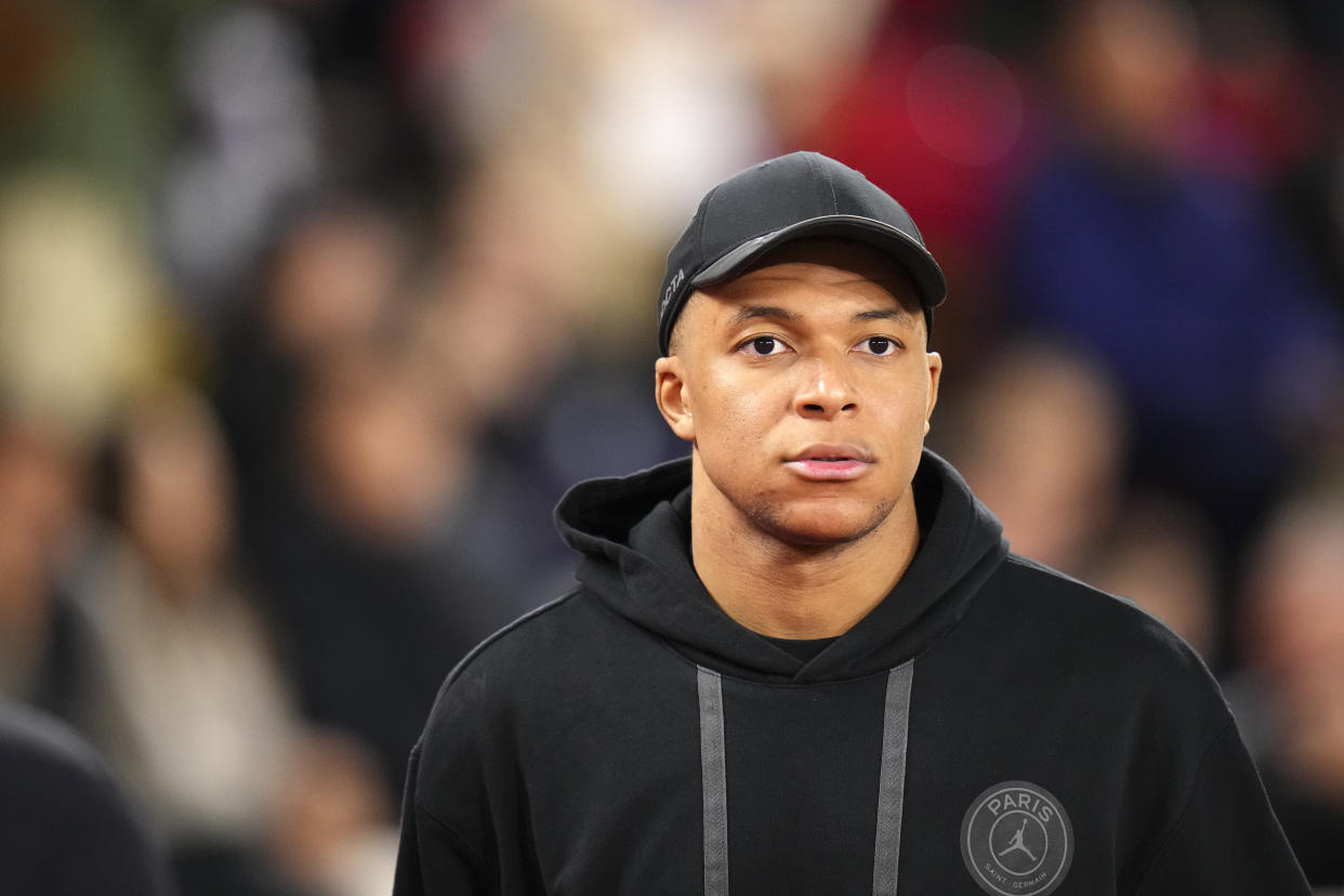 PSG's Kylian Mbappe heads away from the pitch after the French League One soccer match between Monaco and Paris Saint-Germain at the Stade Louis II in Monaco, Friday, March 1, 2024. The match ended in a 0-0 draw. (AP Photo/Daniel Cole)