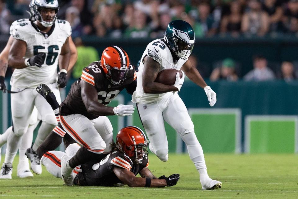 Aug 17, 2023; Philadelphia, Pennsylvania, USA; Philadelphia Eagles running back Rashaad Penny (23) breaks the tackle attempt of Cleveland Browns safety Ronnie Hickman Jr. (33) during the first quarter at Lincoln Financial Field. Mandatory Credit: Bill Streicher-USA TODAY Sports